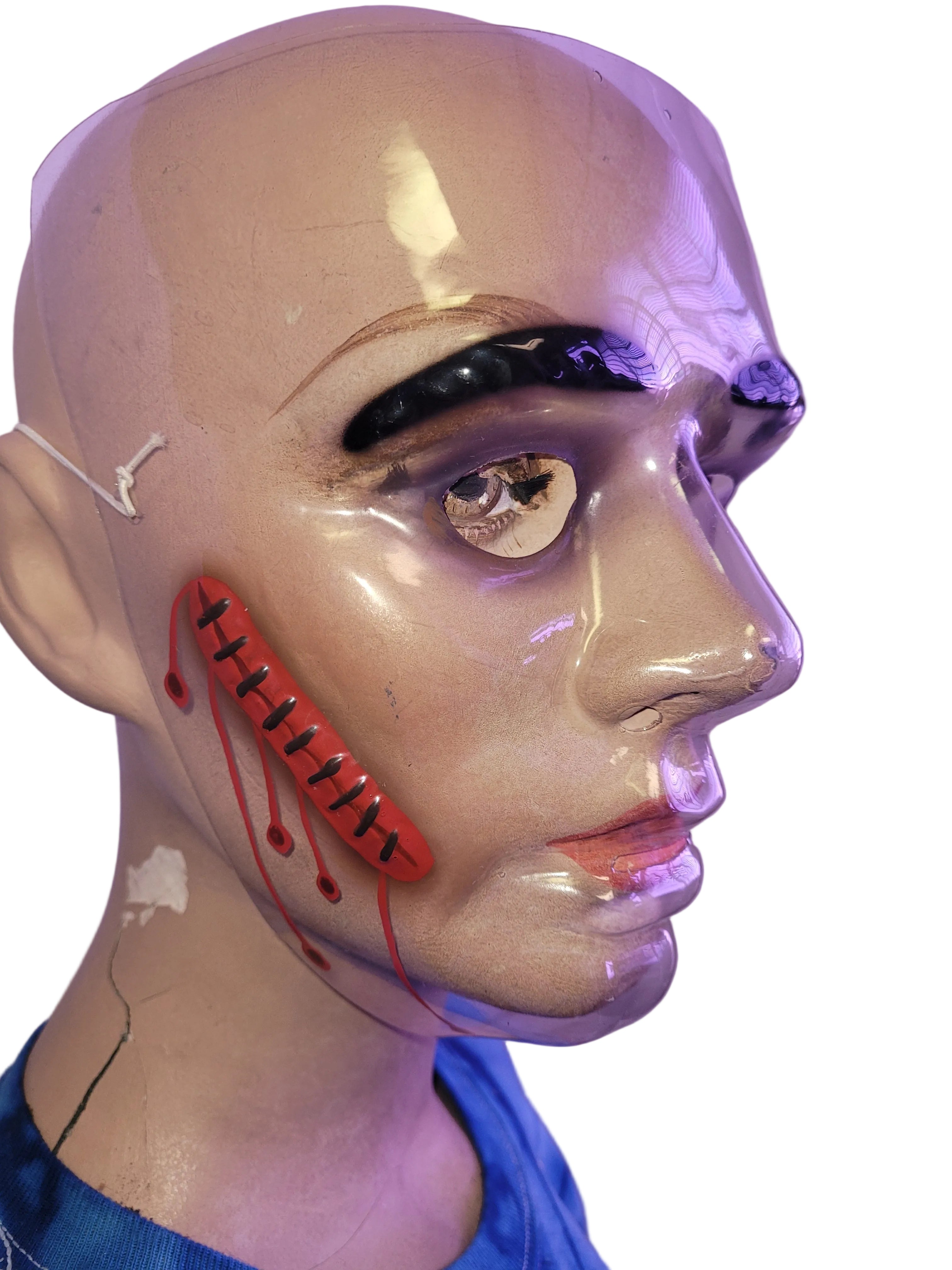 Plastic Wounded Face Bloody Masks by HalloweenStore.com
