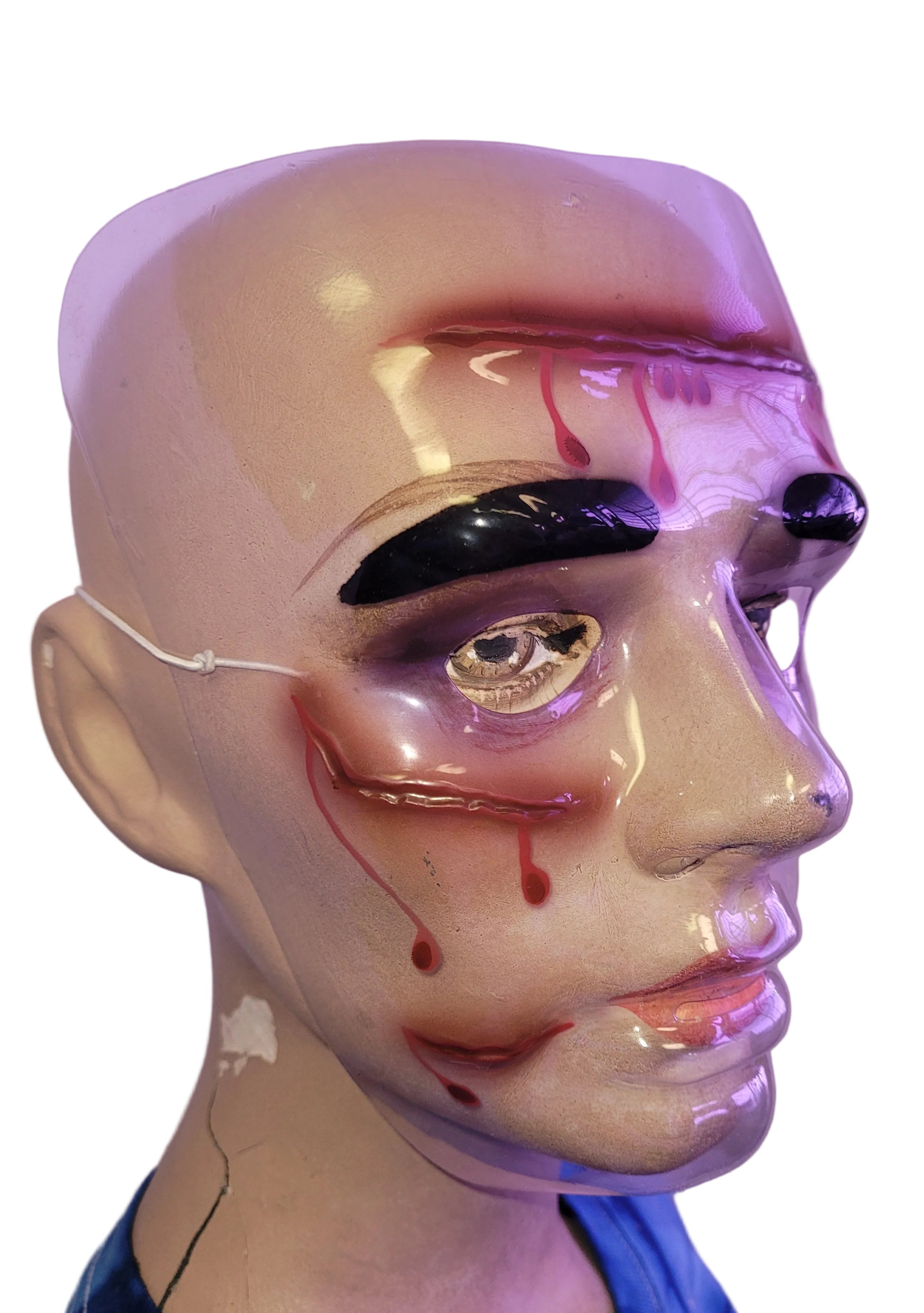 Plastic Wounded Face Bloody Masks by HalloweenStore.com