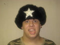 Winter Black Bomber Hat with Black Fur and White Star by HalloweenStore.com