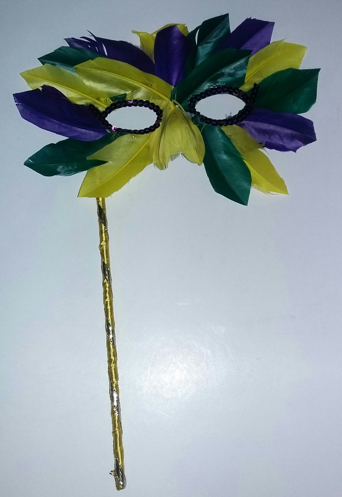 Multicolored Mardi Gras Pointed Feather Masquerade Eye Mask On a Stick 5805 by HalloweenStore.com