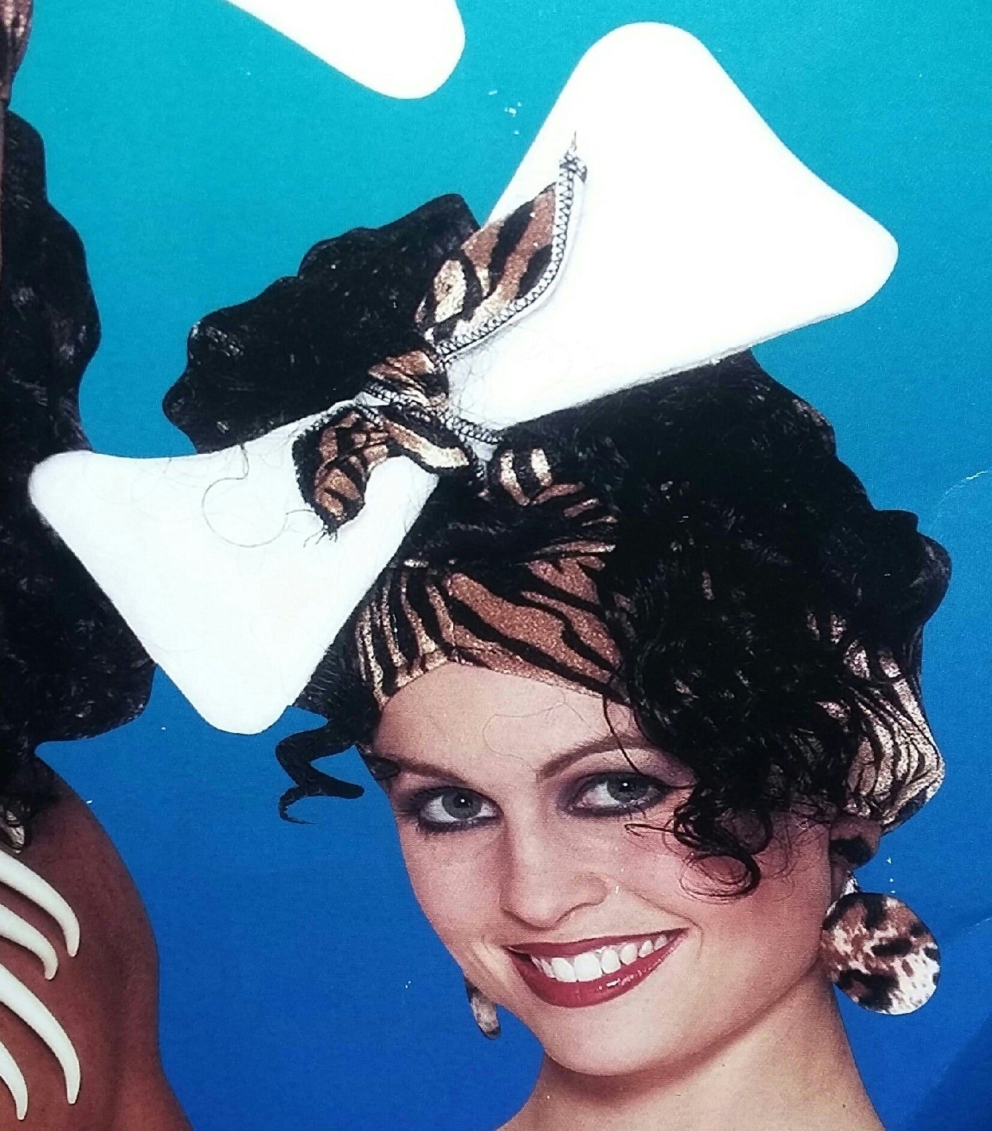 Cavewoman Animal Print Hat with Attached Black Curly Hair Caveman Bone Headpiece by HalloweenStore.com