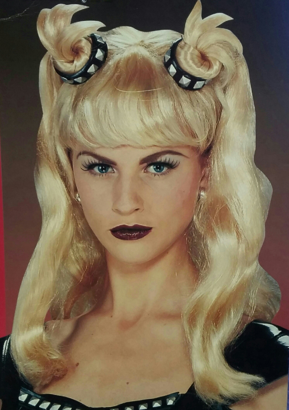 Blonde Dominatrix Wig Wavy Wig with Bangs and Pigtails Studded Choker Accent by HalloweenStore.com