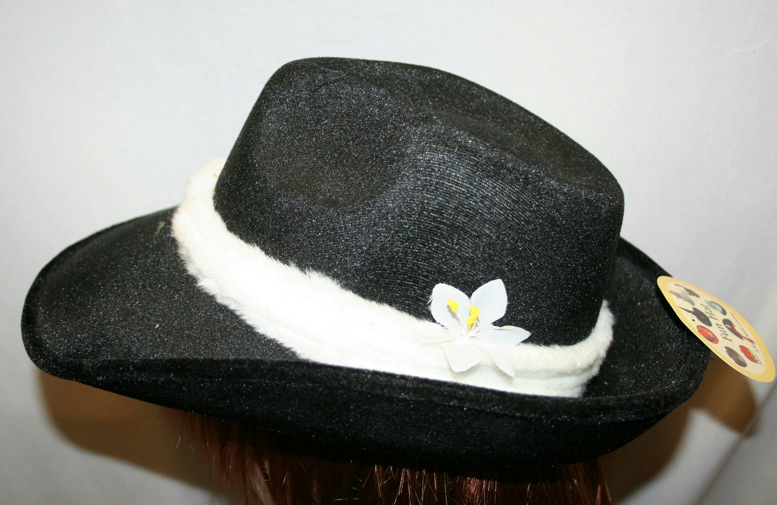 Black Flocked Fedora With White Trim and Flower Costume Hat by HalloweenStore.com