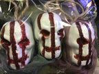 3 Bloody Hanging Skulls with Mesh Netting Hoods by HalloweenStore.com