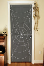 7 Foot Black Spiderweb Door Rope Halloween Decoration by HalloweenStore.com
