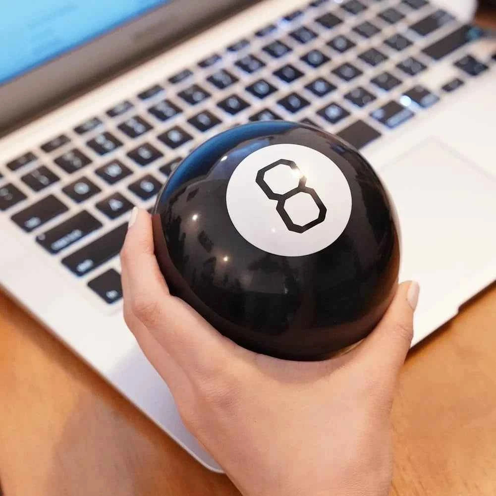 Magic 8 Ball - A mysterious answer ball with a glossy black exterior and white number 8 interior - Party prediction game