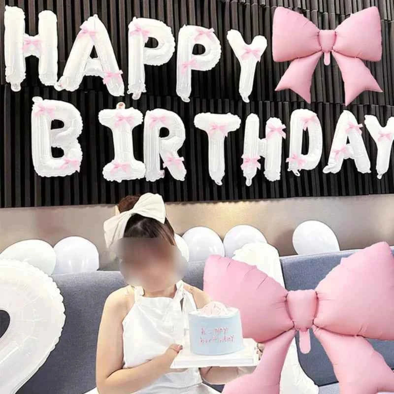 White Happy Birthday banner balloon and light pink bow balloon with pink ribbon bow, birthday party decoration