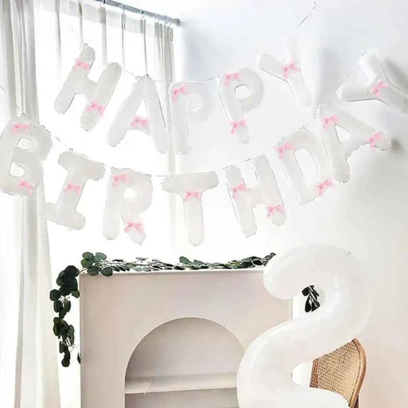 White Happy Birthday banner balloon and light pink bow balloon with pink ribbon bow, birthday party decoration