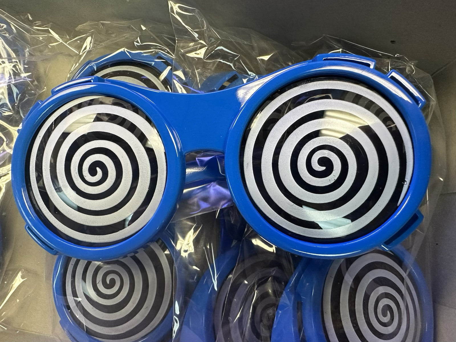 Blue X-Ray Hypnotizing Sunglasses with Swirl Lens by HalloweenStore.com